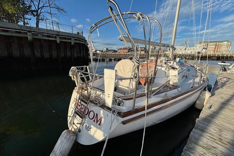 Slide: The Image of 1983 Bristol 38.8 sailboat docked in a marina, sunny day, clear sky. - 3