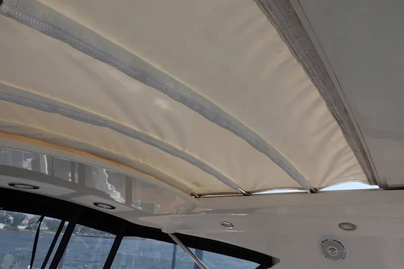 Slide: The Image of Captain's chair and helm of 2012 Sea Ray 450 Sedan Bridge yacht. - 15