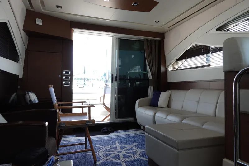 Slide: The Image of Luxurious 2012 Sea Ray 450 Sedan Bridge interior with elegant seating and table. - 21