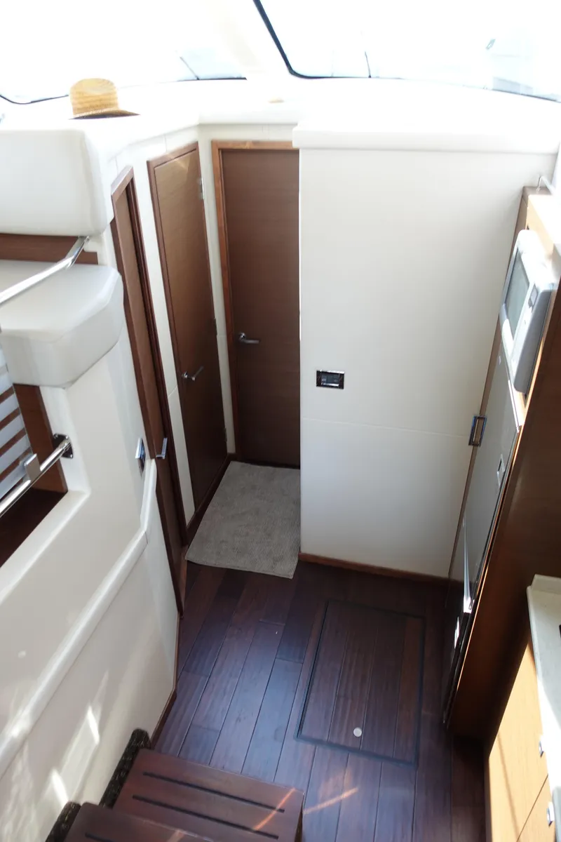 Slide: The Image of Luxurious interior of 2012 Sea Ray 450 Sedan Bridge yacht with modern furnishings. - 27