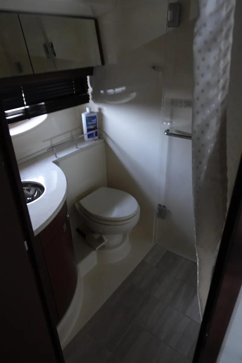 Slide: The Image of Microwave and stainless steel fridge in 2012 Sea Ray 450 Sedan Bridge yacht kitchen. - 32