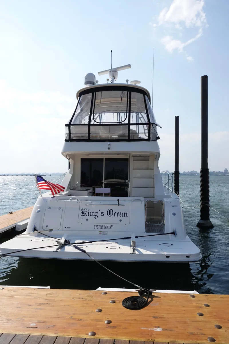 Slide: The Image of 2012 Sea Ray 450 Sedan Bridge yacht docked, named "King's Ocean," Oyster Bay, NY. - 6