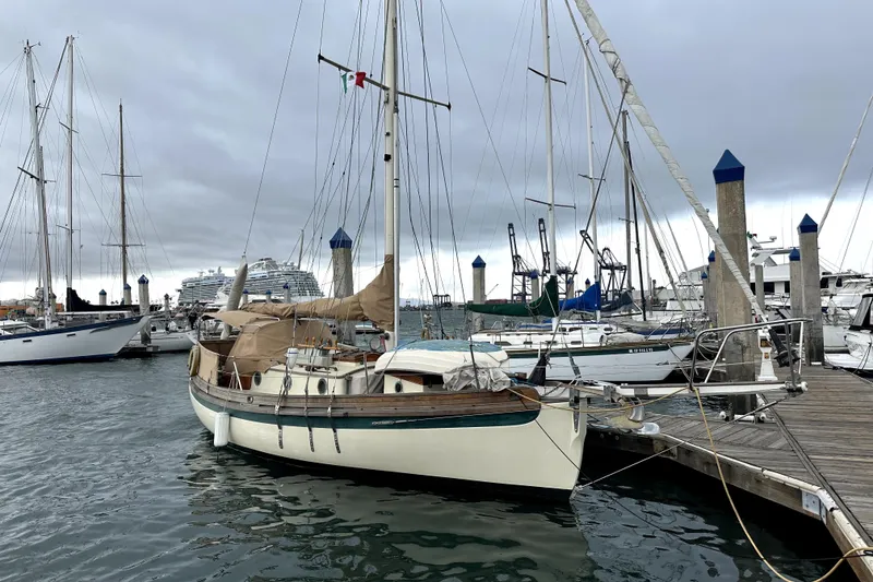 The Image of 2000 Sam L. Morse Bristol Channel Cutter 28 docked in a marina under cloudy skies. - 0