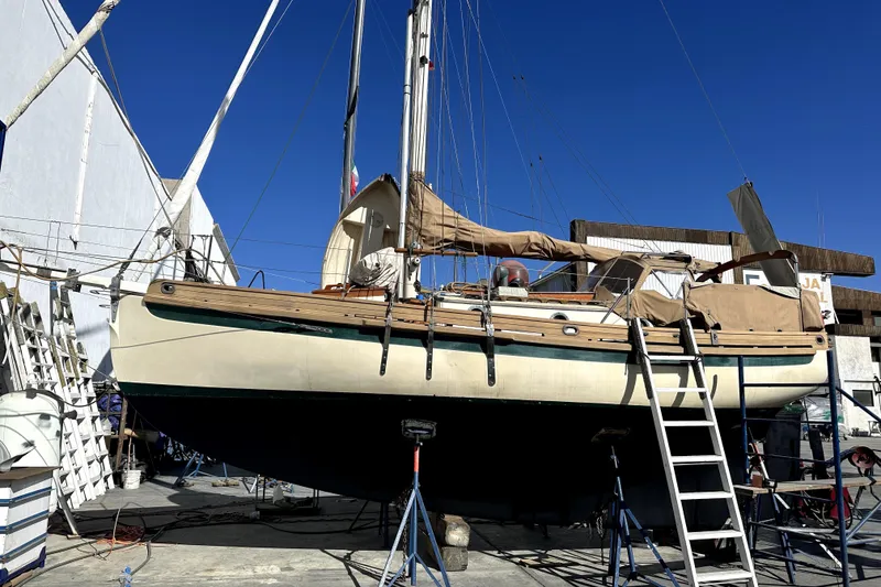 Slide: The Image of Bristol Channel Cutter 28 sailboat by Sam L. Morse, 2000, in dry dock for maintenance. - 10