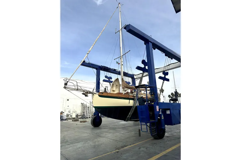 Slide: The Image of Sam L. Morse Bristol Channel Cutter 28, 2000, on a boat lift at a shipyard. - 11
