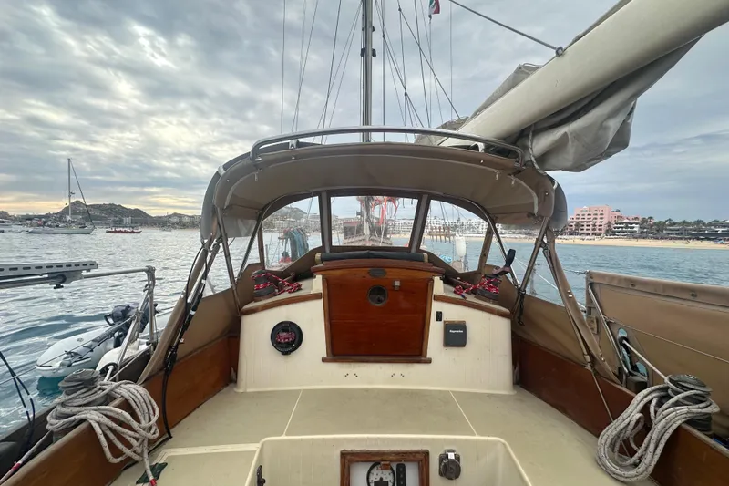 Slide: The Image of Cockpit view of 2000 Sam L. Morse Bristol Channel Cutter 28 sailboat in marina. - 15