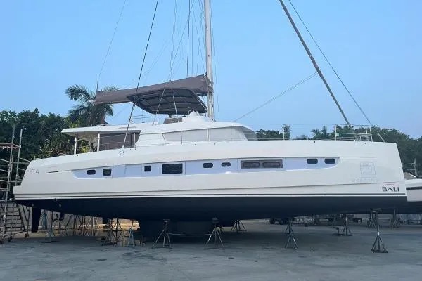 Slide: The Image of 2021 Bali 5.4 catamaran on dry dock, showcasing sleek design and modern features. - 7