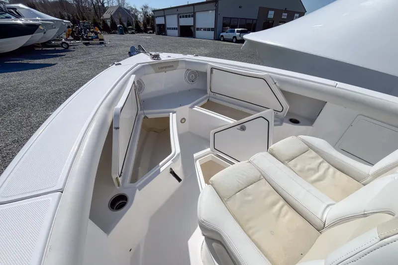 Slide: The Image of 2016 Everglades 255 Center Console boat interior with open storage compartments. - 11