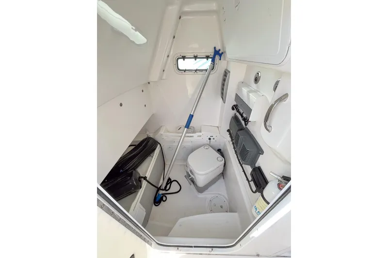 Slide: The Image of Interior of 2016 Everglades 255 Center Console boat with storage and equipment. - 14