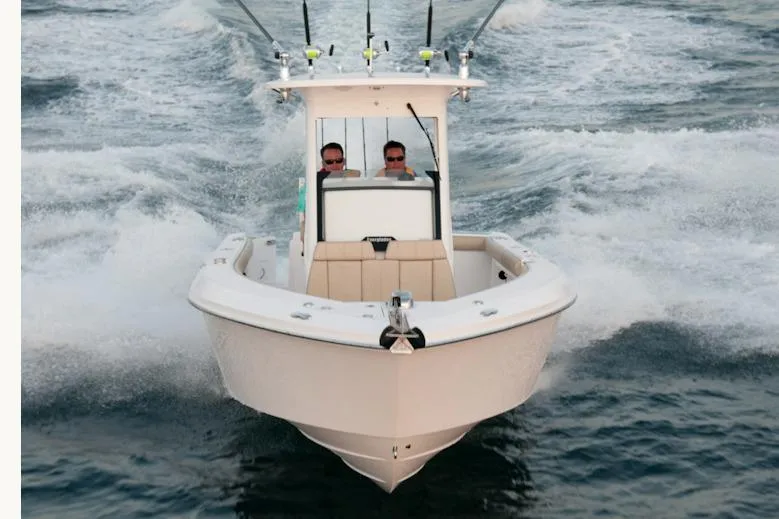 Slide: The Image of Manufacturer Provided Image: 2016 Everglades 255 Center Console boat cruising on water. - 4