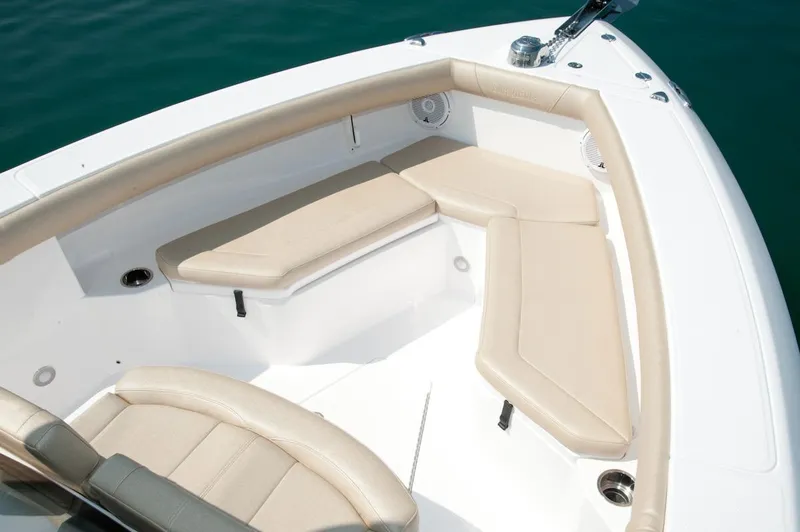 Slide: The Image of Manufacturer Provided Image: 2016 Everglades 255 Center Console boat with beige cushioned seating. - 5