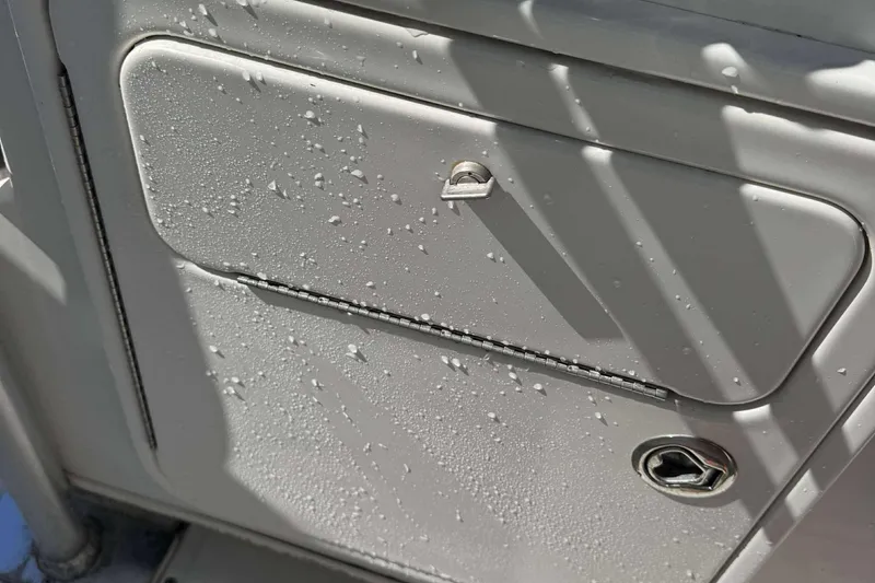 Slide: The Image of Close-up of a wet storage compartment on a 2012 Ranger 2410 Bay Ranger boat. - 15