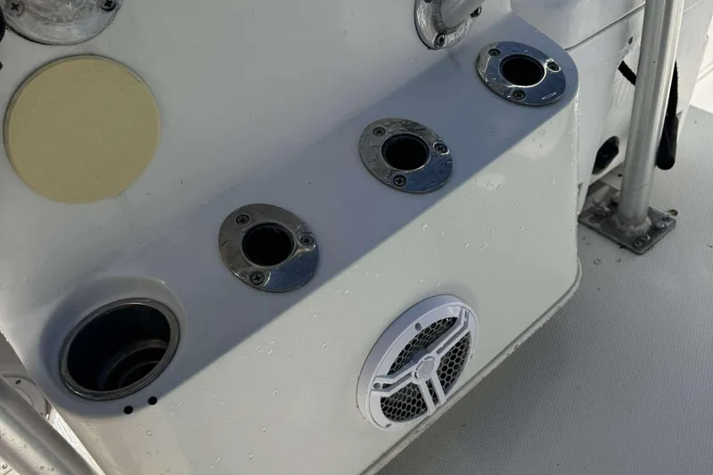 Slide: The Image of 2012 Ranger 2410 Bay Ranger boat console with rod holders and speaker. - 17