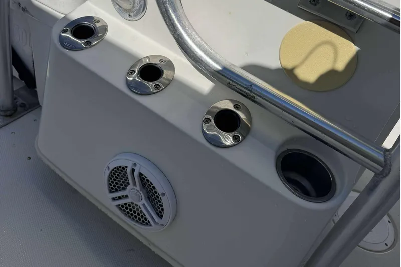 Slide: The Image of 2012 Ranger 2410 Bay Ranger boat console with rod holders and speaker. - 28