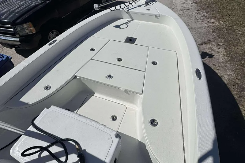 Slide: The Image of 2012 Ranger 2410 Bay Ranger boat deck with storage compartments and clean design. - 7