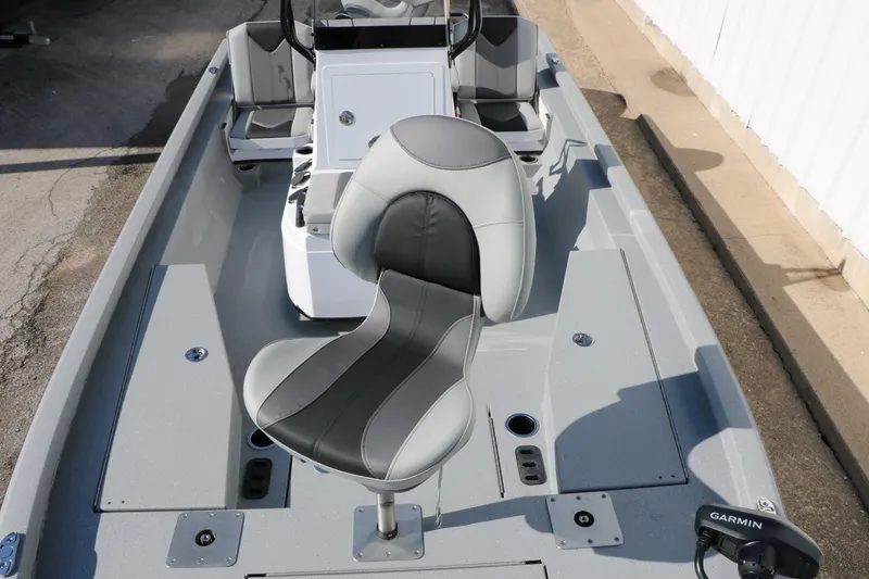 Slide: The Image of 2026 Vexus ACX2000 boat interior with sleek seating and Garmin equipment. - 11