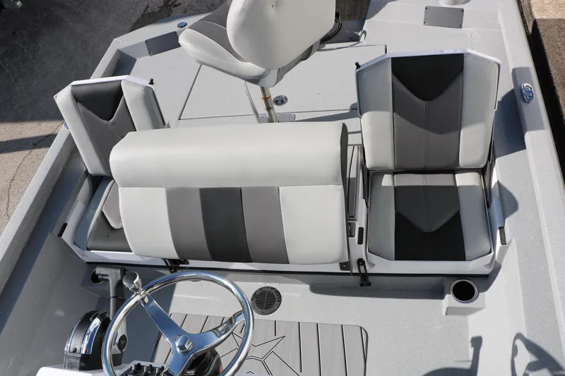 Slide: The Image of 2026 Vexus ACX2000 boat interior with modern seating and steering wheel. - 16