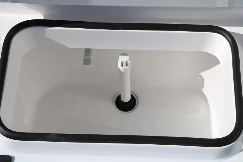 Slide: The Image of Livewell compartment of 2026 Vexus ACX2000 boat, featuring a clean, white interior. - 20