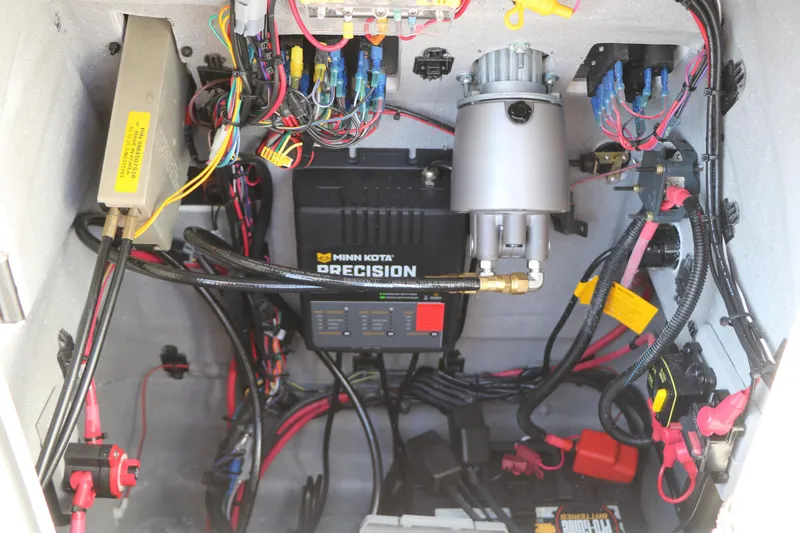 Slide: The Image of Electrical wiring and components inside a 2026 Vexus ACX2000 boat, featuring Minn Kota Precision charger. - 21