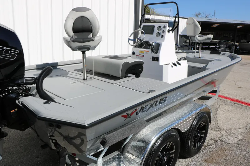 Slide: The Image of 2026 Vexus ACX2000 boat on trailer, featuring modern design and seating. - 3