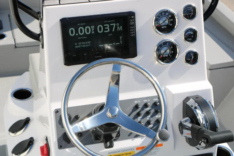 Slide: The Image of Steering console of 2026 Vexus ACX2000 boat with GPS and control gauges. - 31