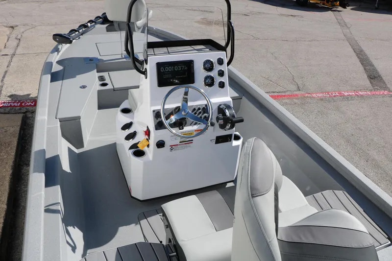 Slide: The Image of 2026 Vexus ACX2000 boat interior with modern steering console and seating. - 9