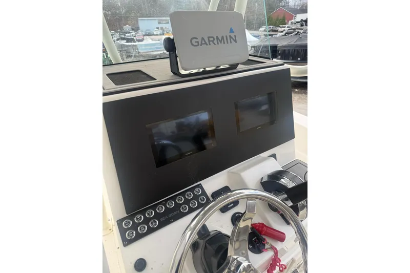 Slide: The Image of 2023 Sea Born LX22 Center Console dashboard with Garmin navigation system. - 10