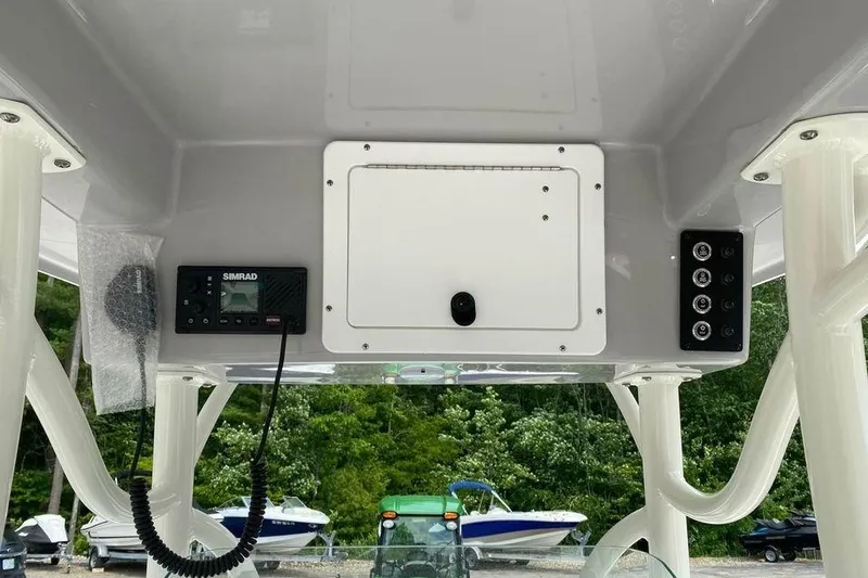 Slide: The Image of 2023 Sea Born LX22 Center Console dashboard with Simrad electronics and control panel. - 11
