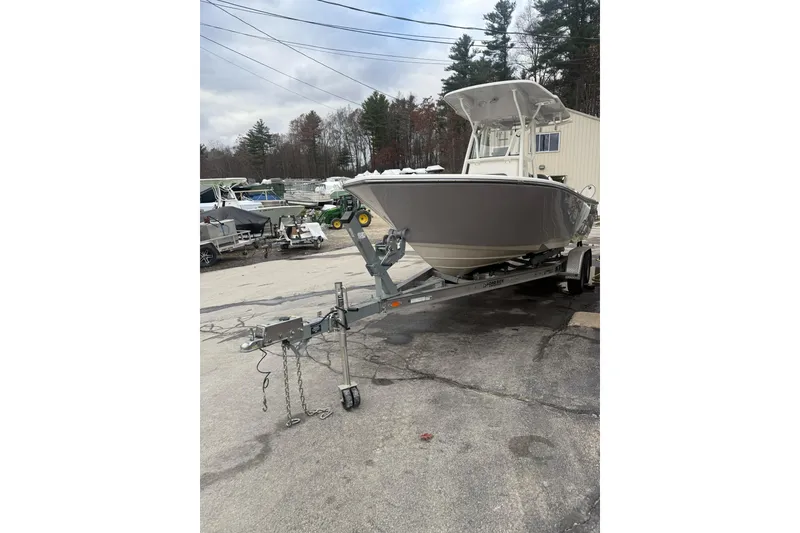Slide: The Image of 2023 Sea Born LX22 Center Console boat on trailer in outdoor setting. - 4