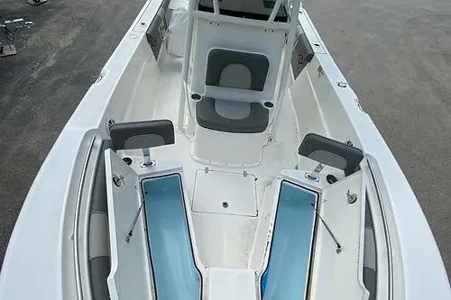 Slide: The Image of 2023 Sea Born LX22 Center Console boat interior with seating and storage compartments. - 6