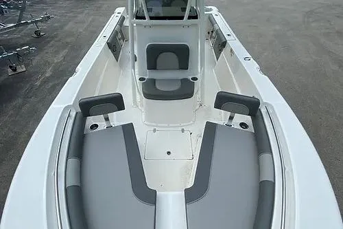 Slide: The Image of 2023 Sea Born LX22 Center Console boat interior with gray seating and cup holders. - 7