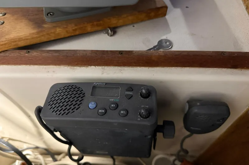 Slide: The Image of VHF radio equipment on 1979 Chris-Craft 350 Catalina boat dashboard. - 17
