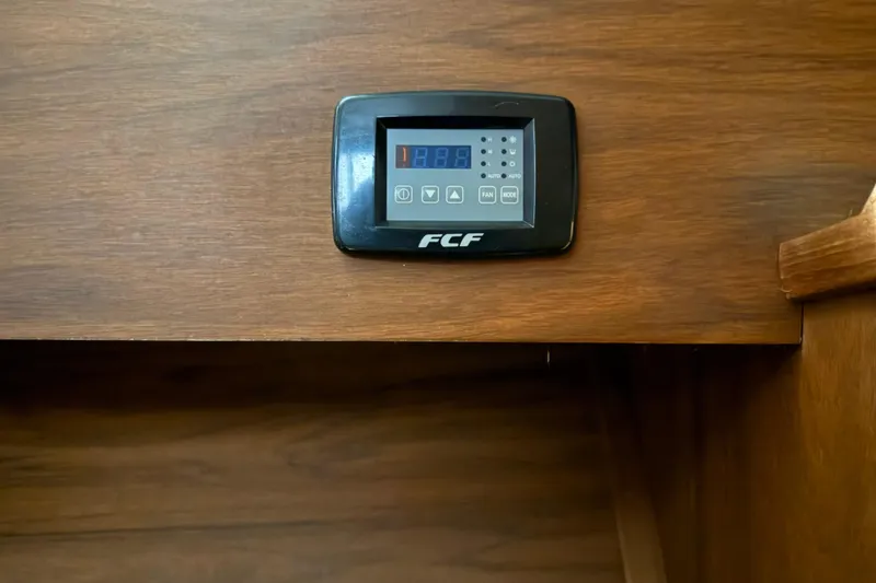 Slide: The Image of Digital control panel on 1979 Chris-Craft 350 Catalina boat's wooden interior. - 19