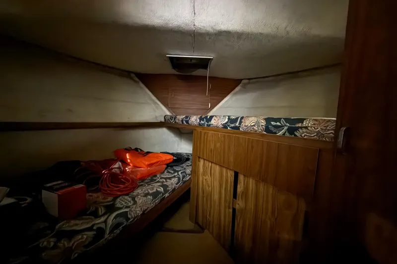 Slide: The Image of 1979 Chris-Craft 350 Catalina cabin interior with beds and storage. - 22