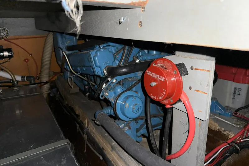 Slide: The Image of Engine compartment of a 1979 Chris-Craft 350 Catalina with visible wiring and components. - 23