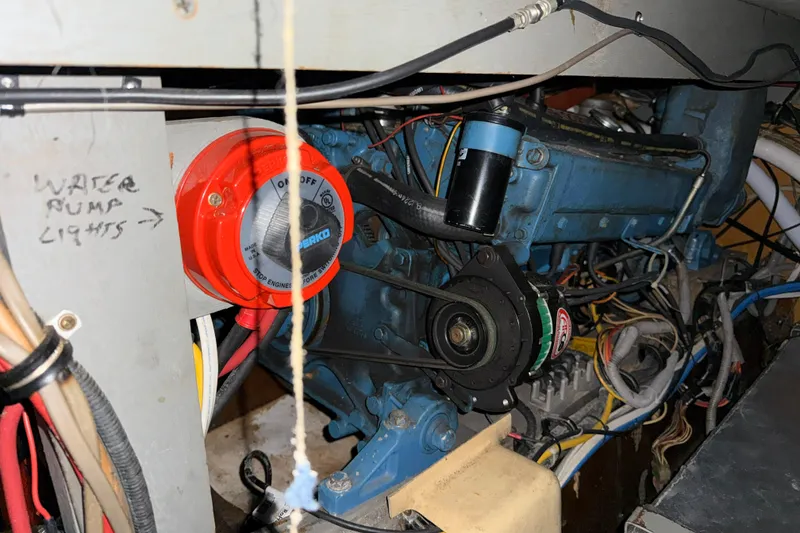 Slide: The Image of Engine compartment of 1979 Chris-Craft 350 Catalina with wiring and components visible. - 24
