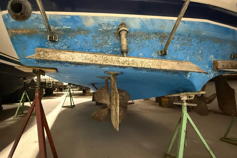 Slide: The Image of 1979 Chris-Craft 350 Catalina boat hull and propeller on stands in storage. - 28