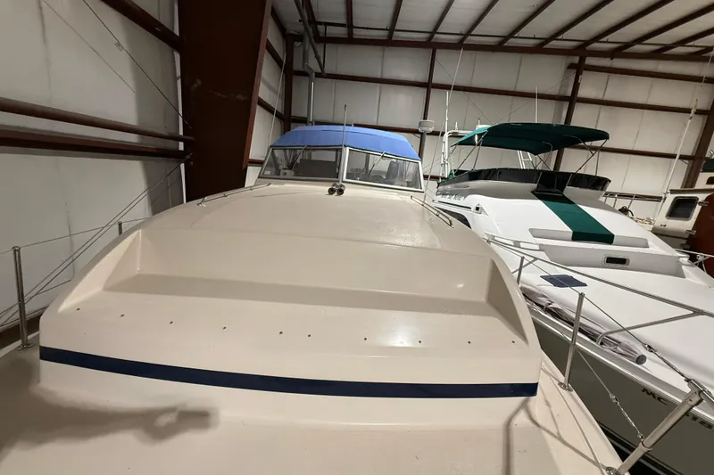 Slide: The Image of 1979 Chris-Craft 350 Catalina yacht in indoor storage, showcasing classic design. - 3