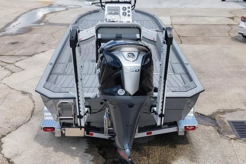 Slide: The Image of 2026 Vexus ACX 2210 boat with powerful 350 engine, rear view on trailer. - 2