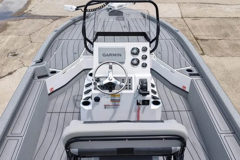 Slide: The Image of 2026 Vexus ACX 2210 boat interior with Garmin navigation system and sleek design. - 3