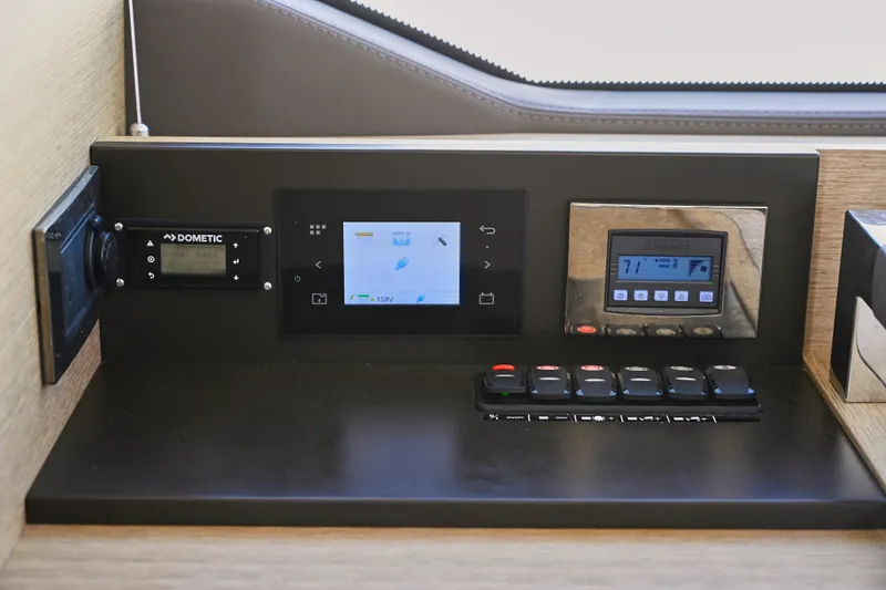 Slide: The Image of Control panel of a 2020 Prestige 460S yacht with digital displays and switches. - 12