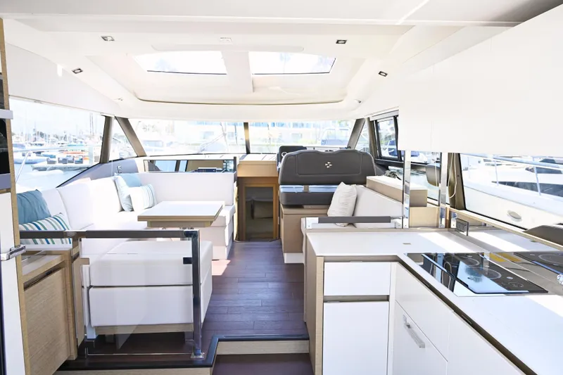 Slide: The Image of Luxurious interior of 2020 Prestige 460S yacht with modern furnishings and panoramic windows. - 14