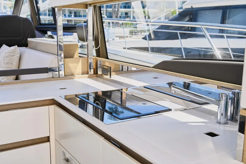 Slide: The Image of Modern kitchen area on a 2020 Prestige 460S yacht, featuring sleek countertops and appliances. - 15