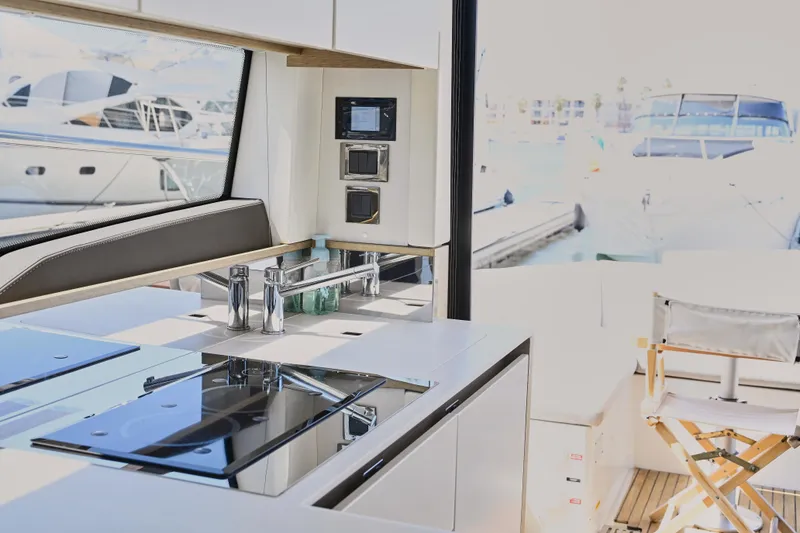Slide: The Image of Modern kitchen interior on 2020 Prestige 460S yacht, with marina view. - 17
