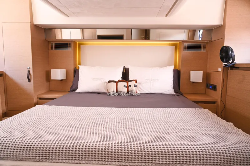 Slide: The Image of Luxurious bedroom interior of 2020 Prestige 460S yacht with modern design and cozy bedding. - 23