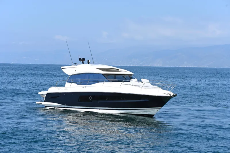 Slide: The Image of 2020 Prestige 460S yacht cruising on open sea under clear blue sky. - 3