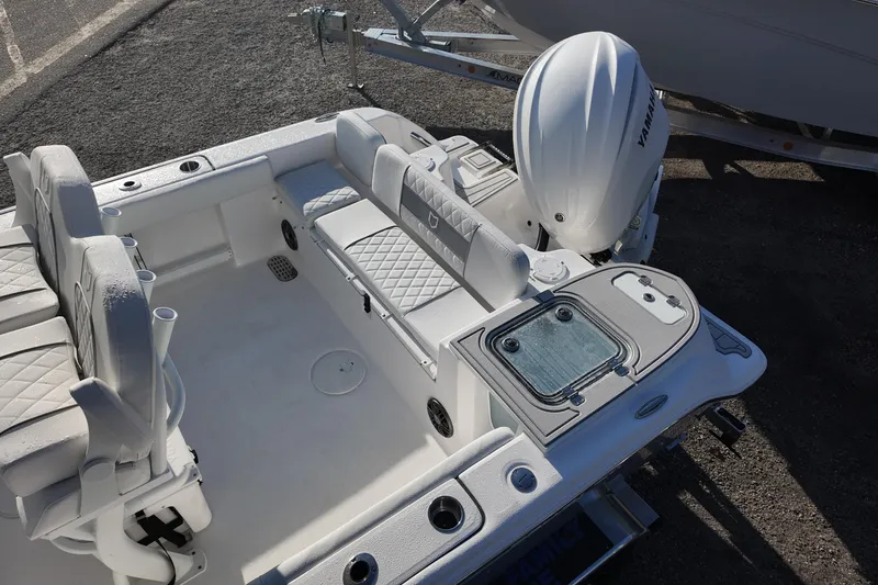 Slide: The Image of 2026 Sea Fox 248 Commander boat interior with Yamaha engine, featuring cushioned seating and storage. - 13