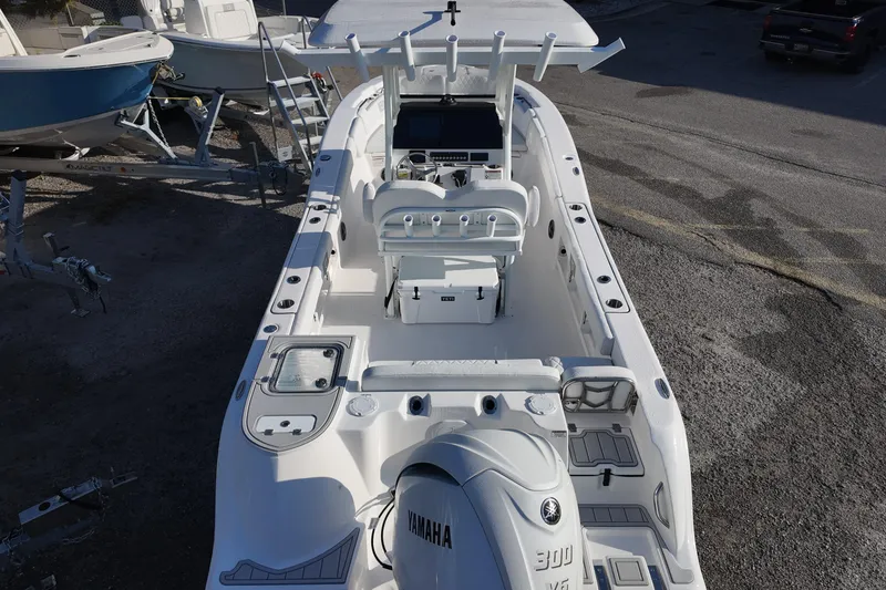 Slide: The Image of 2026 Sea Fox 248 Commander boat with Yamaha 300 engine, docked on a trailer. - 15