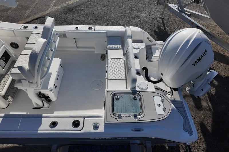 Slide: The Image of 2026 Sea Fox 248 Commander boat interior with Yamaha engine, featuring seating and storage. - 19