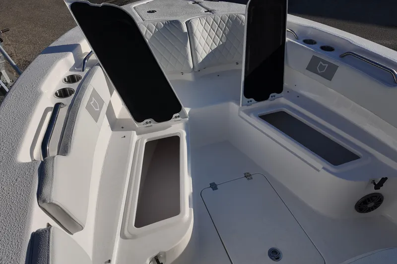 Slide: The Image of 2026 Sea Fox 248 Commander boat interior with open storage compartments and cup holders. - 21